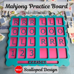 May include: A pink and teal Mahjong practice board with the text "Mahjong Practice Board" and "Fully Customizable". The board has a scalloped design and features letter and number slots. The word "Mahjong" is printed at the bottom.
