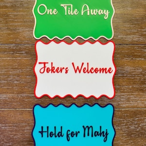 May include: A rustic wooden sign with the text "Welcome to our home" in white lettering. The sign features a distressed finish and a simple, inviting design, perfect for a front porch or entryway.