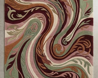 May include: A rectangular area rug featuring a swirling, abstract pattern of organic, leaf-like shapes. The design incorporates a palette of deep burgundy, muted sage green, soft dusty pink, warm terracotta, and cream, with carved textures.