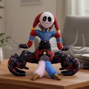 May include: A plush toy with a clown-like face, red and blue clothing, and claw-like hands. The toy has a white face with black eyes and a stitched smile. The body is red and black with a blue and pink leg. The toy is on a wooden surface.
