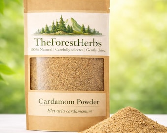 May include: A brown paper pouch of TheForestHerbs Cardamom Powder with a clear window showing the tan spice inside. The label features a mountain and forest graphic, the text 100% Natural | Carefully selected | Gently dried, and Elettaria cardamomum.