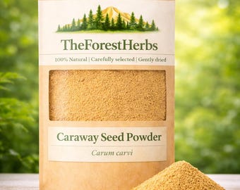 May include: A tan stand-up pouch of TheForestHerbs Caraway Seed Powder with a clear window showing the light brown ground spice. The label features a mountain and forest graphic, the text 100% Natural, Carefully selected, Gently dried.