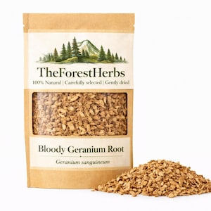 May include: A package of dried Bloody Geranium Root, with the text "The Forest Herbs" and "100% Natural". The package is brown with a clear window showing the root pieces. A small pile of the root is next to the package.
