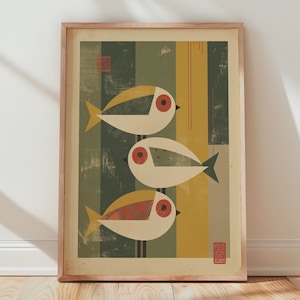 May include: Framed art print featuring three stylized fish in a mid-century modern style. The fish are white with yellow and red accents, set against a background of vertical stripes in green, yellow, and beige. The print is in a wooden frame.