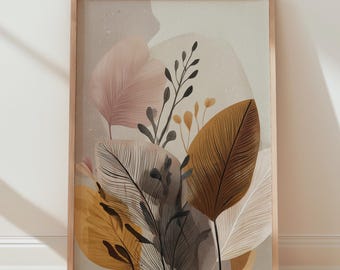 May include: A framed botanical art print featuring stylized leaves in shades of gold, pink, and gray. The artwork is displayed against a neutral background, with a wooden frame. The print is leaning against a white wall on a wooden floor.