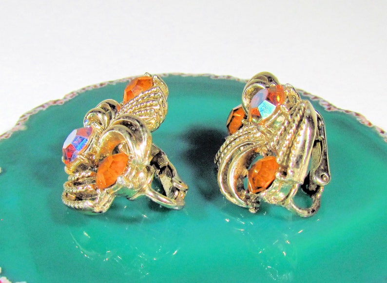 Vintage Coro Pegasus Goldtone and Orange Citrine Glass Round Rhinestone Textured Clip On Earrings