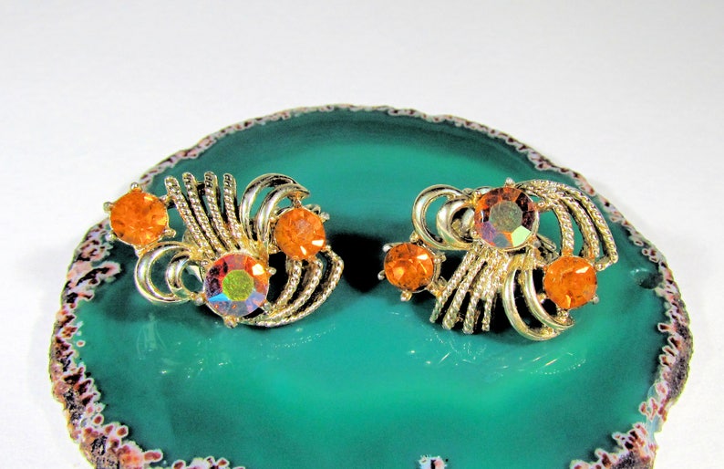 Vintage Coro Pegasus Goldtone and Orange Citrine Glass Round Rhinestone Textured Clip On Earrings