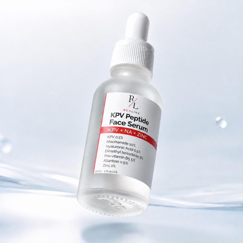 May include: A clear glass dropper bottle of Redline KPV Peptide Face Serum. The white label features black text listing ingredients including KPV 0.1%, Niacinamide 10%, Hyaluronic Acid 0.5%, and Zinc 1%. The bottle contains 30ml, 1 fl oz U.S. of liquid.