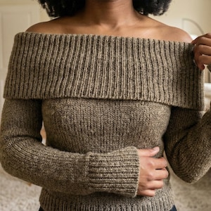 May include: A set of three ceramic mugs with a speckled, matte finish. The mugs are in shades of cream, light gray, and dark gray. Each mug has a simple, minimalist design, perfect for coffee or tea.