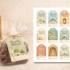 May include: A gift bag of dates tied with a twine bow, featuring a tag with the text "Ramadan Mubarak" and a mosque illustration. A sheet of matching gift tags with mosque and lantern designs is also visible.