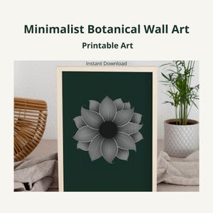 Pode incluir: Uma impressão emoldurada com o texto "Minimalist Botanical Wall Art Printable Art" apresenta um design floral em tons de cinza sobre um fundo verde escuro. As palavras "Instant Download" também são visíveis. A obra de arte é exibida perto de uma cesta tecida e de uma planta em vaso.