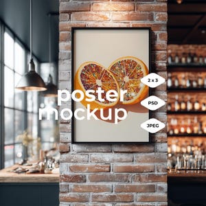 May include: A framed poster mockup showing a colourful illustration of two orange halves with sparkling details. The poster is displayed on a brick wall, with the words "poster mockup" in white text. Labels indicate "2 x 3", "PSD", and "JPEG".