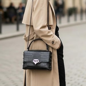 May include: A set of three ceramic nesting bowls in shades of blue, green, and white. The bowls have a speckled glaze and a simple, modern design. The largest bowl is about 15 cm in diameter.