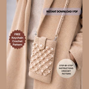 May include: A beige crochet phone bag with a pearl embellishment and a matching strap. The bag has a flap closure with a pearl button. The image includes text that says "INSTANT DOWNLOAD | PDF" and "FREE Keychain Crochet Pattern".