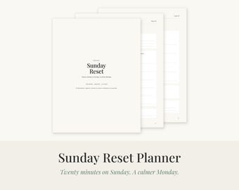 May include: A white Sunday Reset planner with black text featuring the title Sunday Reset and the subtitle Twenty minutes on Sunday. A calmer Monday. The planner consists of multiple stacked pages with lined sections for organization and planning.