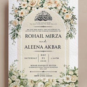 May include: An invitation card with a floral design. The card features a cream-colored background with a floral border of white and cream roses and greenery. The text includes the names "ROHAIL MIRZA" and "ALEENA AKBAR", along with the date, time, and location of the event.