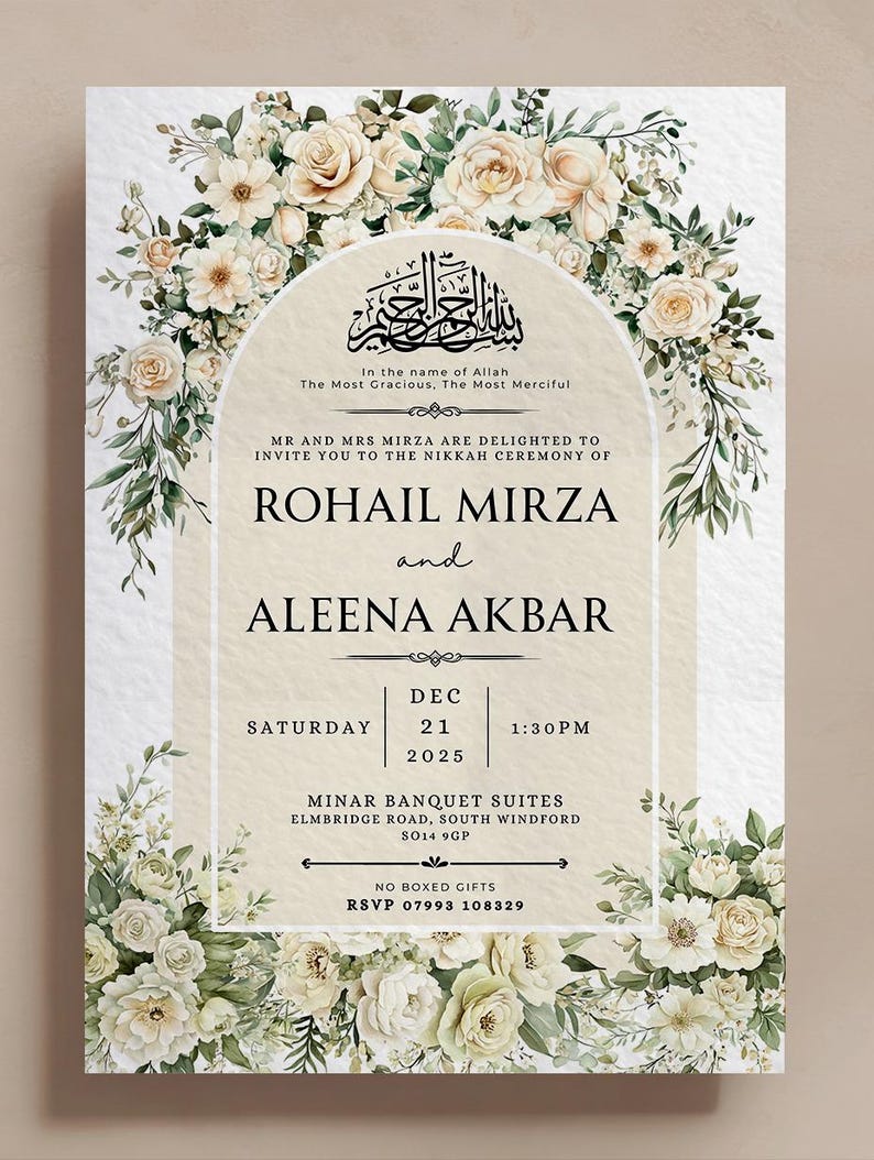 May include: An invitation card with a floral design. The card features a cream-colored background with a floral border of white and cream roses and greenery. The text includes the names "ROHAIL MIRZA" and "ALEENA AKBAR", along with the date, time, and location of the event.