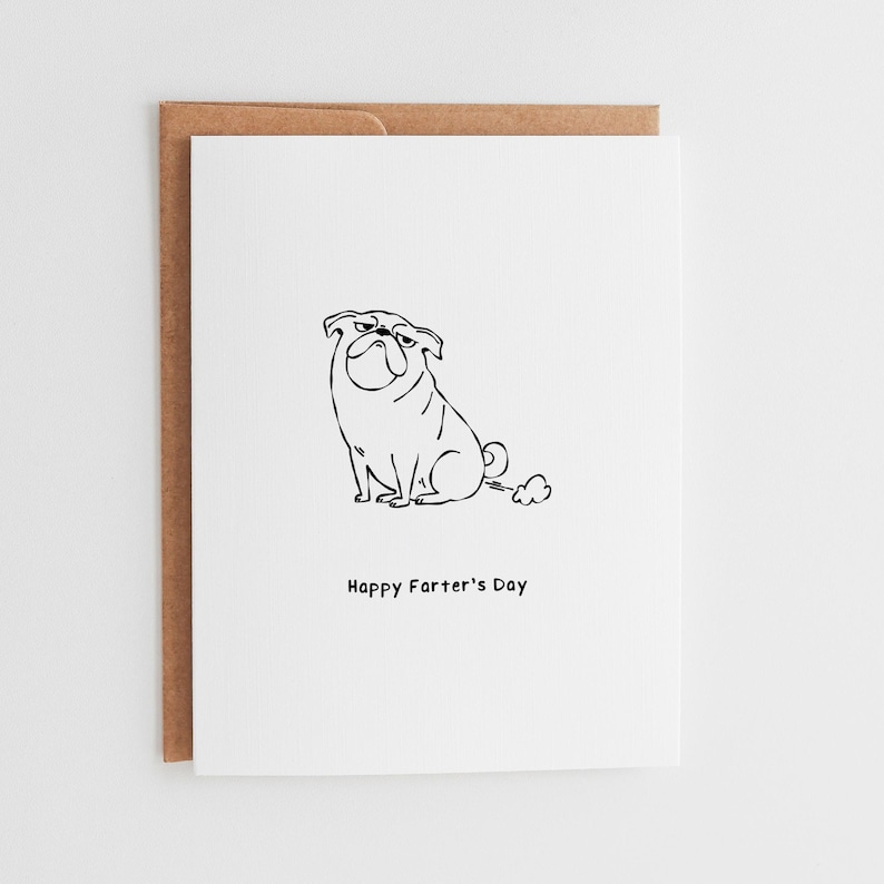 May include: A white greeting card featuring a black line drawing of a pug dog with a small cloud behind it. Below the illustration, the text reads Happy Farter's Day in a simple black font. The card is paired with a brown kraft paper envelope.