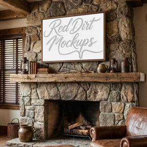 May include: A rustic fireplace with a stone facade and a wooden mantel. A framed canvas with the text "Red Dirt Mockups" hangs above the mantel. Decorative items include books, lanterns, and vases. A leather armchair is in the foreground.