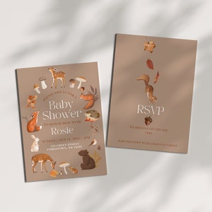 May include: A brown baby shower invitation with a woodland theme. The invitation features a circle of woodland animals, including a squirrel, deer, hedgehog, fox, and rabbit. The text on the invitation reads "Please join us for a Baby Shower to honor Mom to be Rosie, Sunday Oct 11, 2025, 4pm, 123 Green Street, Forestown, ND 12343". The RSVP card is brown with a squirrel and the text "RSVP to Helena on 123-456-7890, Baby Registry with Amazon & Target".