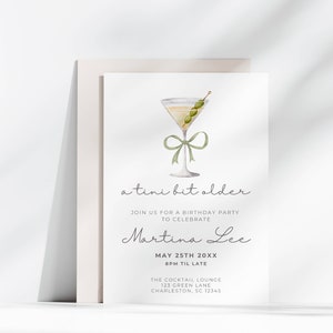 May include: A white invitation card with a green watercolor illustration of a martini glass with olives and a green ribbon. The text on the card reads "a tini bit older" and "Join us for a birthday party to celebrate Martina Lee May 25th 20XX 8PM til late The Cocktail Lounge 123 Green Lane Charleston, SC 12345"