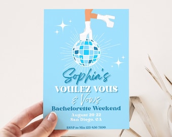 May include: A light blue invitation with a disco ball and a woman's leg in a white platform shoe. The text reads "Sophia's Voulez Vous & Vows Bachelorette Weekend August 20-22 San Diego, CA RSVP to Mia 123-456-7890"