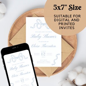 May include: A blue and white baby shower invitation with a blue ribbon design. The invitation is for Eloise Thornton and is for a baby shower on March 12th. The invitation is 5x7 inches and is suitable for digital and printed invites.