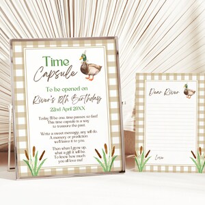 May include: A time capsule printable with a brown and green duck illustration and the text "Time Capsule" and "To be opened on River's 18th Birthday 22nd April 20XX". The printable also includes a note card with the text "Dear River" and a space for writing a message.