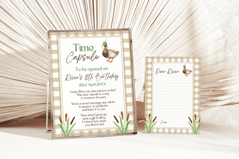 May include: A time capsule printable with a brown and green duck illustration and the text "Time Capsule" and "To be opened on River's 18th Birthday 22nd April 20XX". The printable also includes a note card with the text "Dear River" and a space for writing a message.