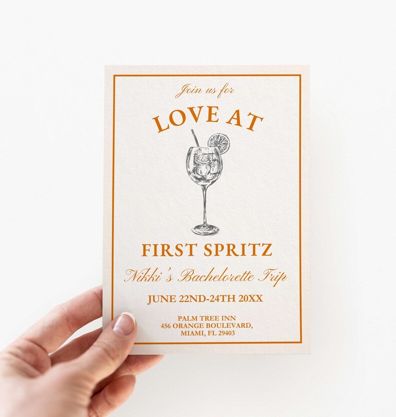 May include: Orange and white invitation for a bachelorette party called "Love at First Spritz". The invitation features a drawing of a glass of a spritzer with a lemon slice and a straw. The text includes the date, June 22nd-24th 20XX, and the location, Palm Tree Inn, 456 Orange Boulevard, Miami, FL 29403.