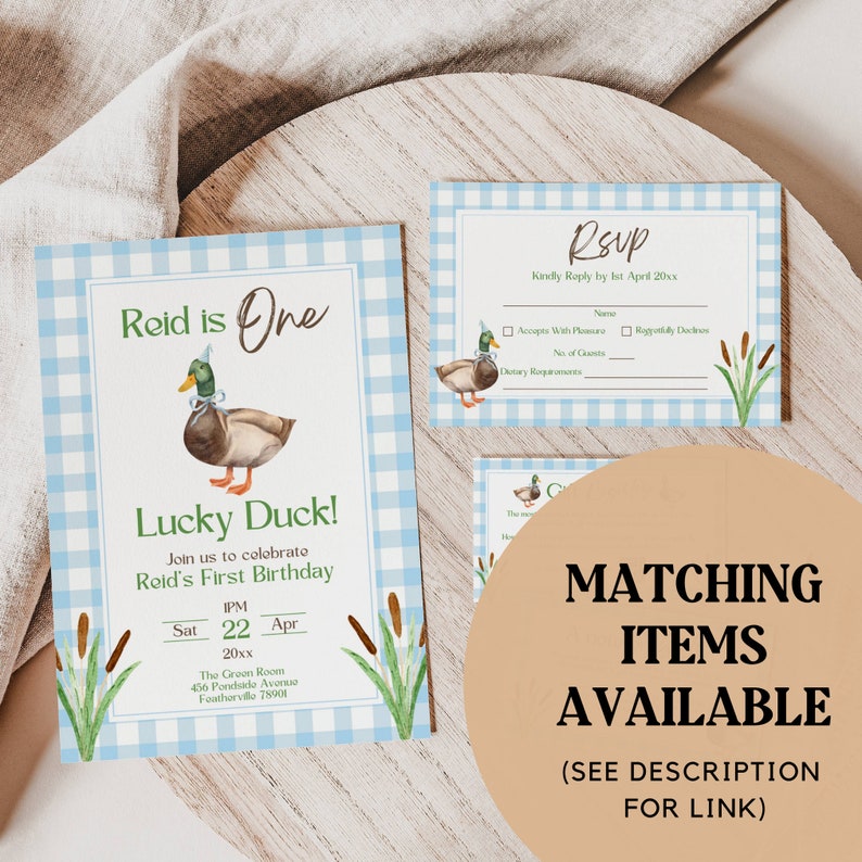 May include: A blue and white gingham patterned invitation for a first birthday party. The invitation features a cartoon duck wearing a party hat and the text "Reid is One" and "Lucky Duck!" The invitation also includes the text "Join us to celebrate Reid's First Birthday" and the date and time of the party.