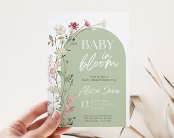 May include: A green and white baby shower invitation with a floral design and the text "BABY in bloom". The invitation includes the date, time, and location of the shower, as well as the name of the guest of honor, Alice Jane.