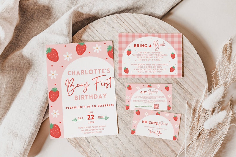 May include: A pink and red birthday invitation with a strawberry theme. The invitation says "Charlotte's Berry First Birthday" and includes details about the party, including the date, time, and location. The invitation also includes a request for guests to bring a book instead of a gift.
