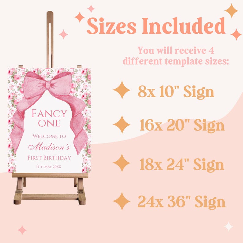 Op de afbeelding: Een roze en wit bloemenbord met een grote roze strik en de tekst "Fancy One" en "Welcome to Madison's First Birthday 15th May 20XX". Het bord staat op een klein houten ezel. De afbeelding toont ook tekst die vier verschillende maten van het bord vermeldt: 8x10", 16x20", 18x24" en 24x36".
