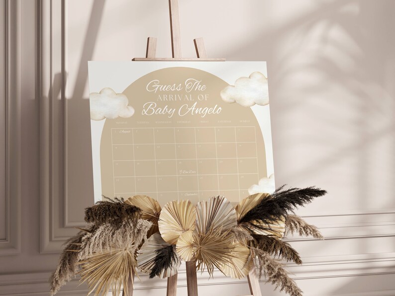 K&ouml;nnte beinhalten: Ein beige-wei&szlig;es Babyparty-Spielschild mit dem Text "Erraten Sie die Ankunft von Baby Angelo" und einem Kalenderrraster mit den Daten f&uuml;r den Monat November.