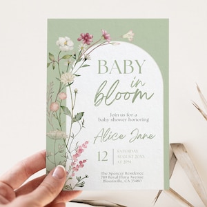 May include: A green and white baby shower invitation with a floral design and the text "BABY in bloom" and "Alice Jane". The invitation includes the date, time, and location of the shower.