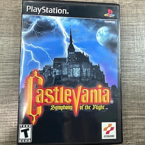 May include: Castlevania: Symphony of the Night PlayStation game case. The cover features a gothic castle under a stormy sky with lightning and a full moon. The game title is in gold and red lettering.