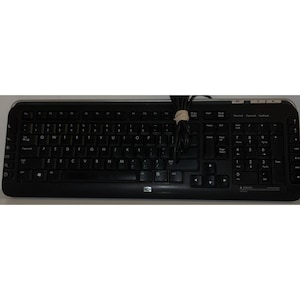 May include: Black HP wired keyboard with standard QWERTY layout. The keyboard has a numeric keypad, function keys, and arrow keys. The cable is black and secured with a rubber band. The HP logo is visible on the bottom center.