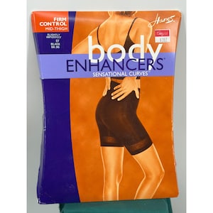May include: Hanes body enhancers firm control mid-thigh shapewear packaging in black. The front of the box features text including Hanes, body enhancers, sensational curves, firm control, mid-thigh, slightly imperfect, EF, and black.