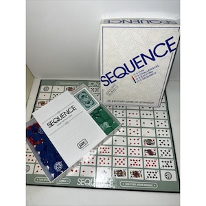 May include: The Sequence board game set includes a folding game board with a grid of playing cards, a box lid with the text SEQUENCE, a game instruction booklet, a deck of cards, and a collection of blue and green plastic playing chips.