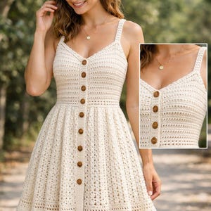 May include: A cream-colored crochet dress with a button-down front and spaghetti straps. The dress features a fitted bodice and a flared skirt, with wooden buttons and a scalloped hemline. The dress is a summer or spring fashion item.