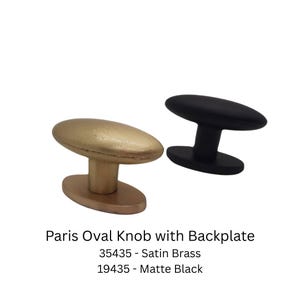 May include: Two oval cabinet knobs with backplates. One is satin brass, the other is matte black. The knobs are labelled "Paris Oval Knob with Backplate". The satin brass knob is labelled "35435" and the matte black knob is labelled "19435".