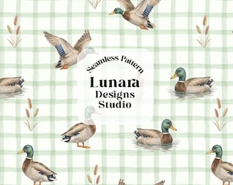 May include: A seamless pattern featuring watercolor mallard ducks in various poses, including flying and swimming, interspersed with cattails against a light green and white checkered background. Text reads Seamless Pattern Lunara Designs Studio.