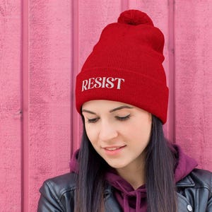 ACLU Benefit | "RESIST" Red Resistance Knit Pom Beanie Embroidered Hat