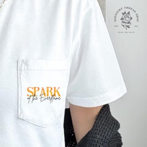 Officially Licensed SPARK of the Everflame Pocket Tee | Flame Pattern Script | Penn Cole Merch