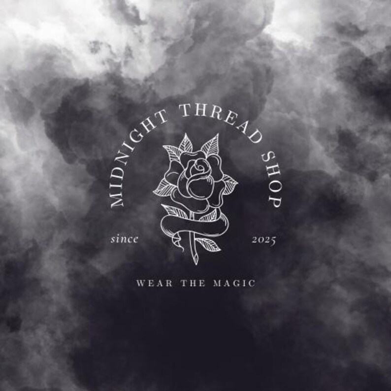 May include: A logo for Midnight Thread Shop, featuring a white rose illustration within a circular frame. The text "MIDNIGHT THREAD SHOP" arches above the rose, with "since 2025" and "WEAR THE MAGIC" below. The background is a dark, cloudy gradient.