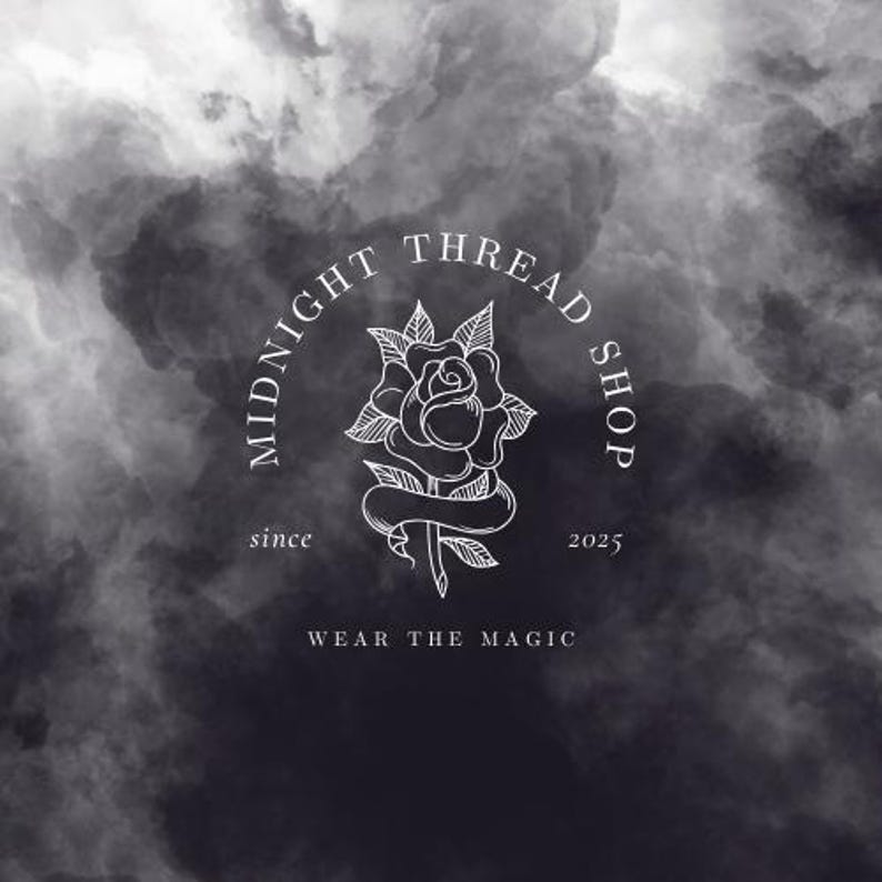 May include: A logo for Midnight Thread Shop, featuring a white rose illustration within a circular frame. The text "MIDNIGHT THREAD SHOP" arches above the rose, with "since 2025" and "WEAR THE MAGIC" below. The background is a dark, cloudy gradient.