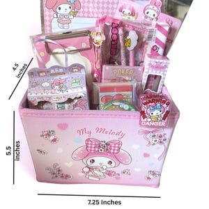 May include: A pink My Melody themed storage basket measuring 5.5 inches high and 7.25 inches wide, filled with stationery items including a clipboard, pens, and stickers. A small sign indicates a height of 4.5 inches for the internal items.