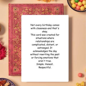 May include: A greeting card with text on a decorative book. The card reads, "Not every birthday comes with closeness-and that's okay." The book has a red cover with gold floral patterns. The card is for complicated relationships.