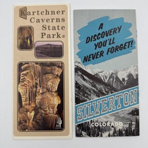 May include: Two vintage travel brochures. One features Kartchner Caverns State Park with images of cave formations and the park entrance. The other, for Silverton, Colorado, has a mountain landscape and the text "A Discovery You'll Never Forget!"